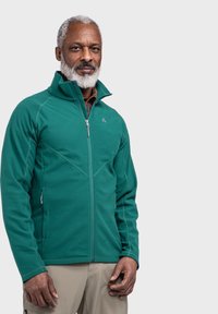 Grüne Fleecejacke mit hohem Kragen, Reißverschluss vorn und Seitentaschen. Mit kontrastierendem Nähen und einem dezenten Logo auf der Brust.