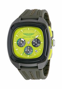 Orologio quadrato con un quadrante giallo brillante, sottodial neri, cinturino in silicone grigio scuro e dettagli argentati sulla corona e sulla cassa.