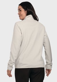 Light gray fleece jacket with a high collar, long sleeves, and smooth texture, featuring a plain design and no visible hardware.