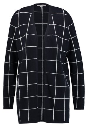 Cardigan noir ouvert devant avec manches longues et motif quadrillé blanc partout.