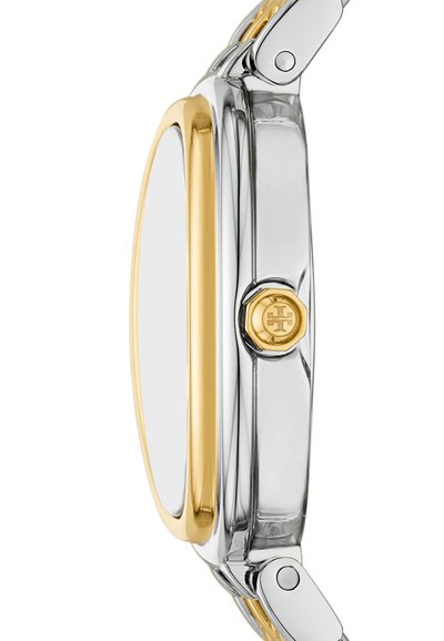 Oval ur med et sølvfarvet rustfrit stål hus og guldaccenter. Har en glat, poleret overflade og en hævet logodetail på siden.