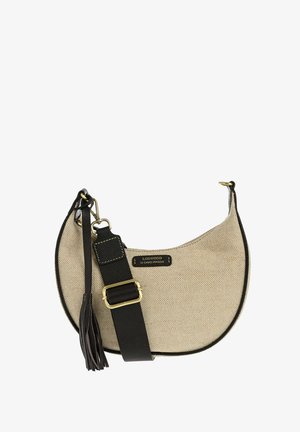 Sac d'épaule en tissu beige en forme de croissant avec une sangle réglable en cuir noir et un pompon, avec une étiquette "Loxwood Le Cabas Parisien".