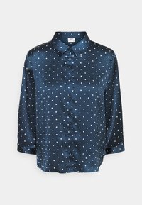 Blusa di raso blu navy con Pois bianchi, design con colletto, chiusura a bottoni e maniche a tre quarti. Texture liscia e finitura lucida.