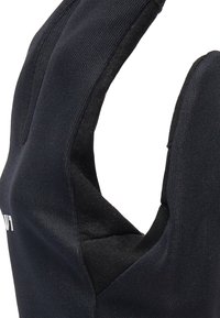 Gant en noir avec un tissu texturé et une doublure intérieure douce. Design à doigts ouverts pour plus de dextérité. Détail du logo au niveau du poignet.