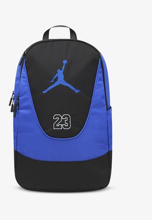 Black and blue backpack with a zippered front pocket, showing a blue silhouette of a basketball player and the number 23 in white.