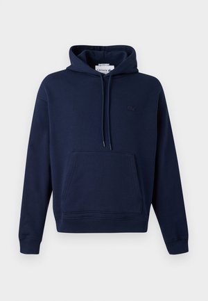 Marineblauwe hooded sweatshirt van zachte stof. Voorzien van een voorzak en een klein geborduurd logo op de borst.