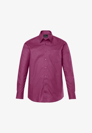 Košile s dlouhým rukávem v tmavě měděné látce, vybavená špičatým límcem, předními knoflíky a kapsou na hrudi. Hladká textura s přiléhavým střihem.