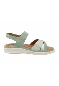Mint green sandal featuring a textured cross strap design, an ankle strap, and a white rubber sole with ribbed detailing.