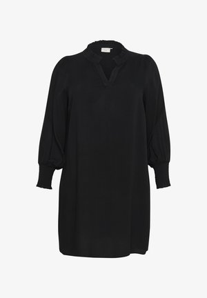 Juoda tunika su tekstūruotu audiniu, su užsegimu prie kaklo ir pūstomis rankovėmis su elastinėmis apykaklėmis. Šiek tiek išsiplėtusi siluetas.