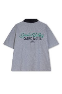 Striped short-sleeve shirt in blue and white, featuring "Devil's Valley CASINO MOTEL" in green and black embroidery on the back.