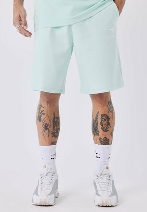 ESSENTIALS - Pantalones deportivos - honeydew