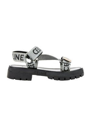 Sort sål sandal med grå tekstilremme trykt med "CELINE", med justerbare lukninger og et robust slidmønster.