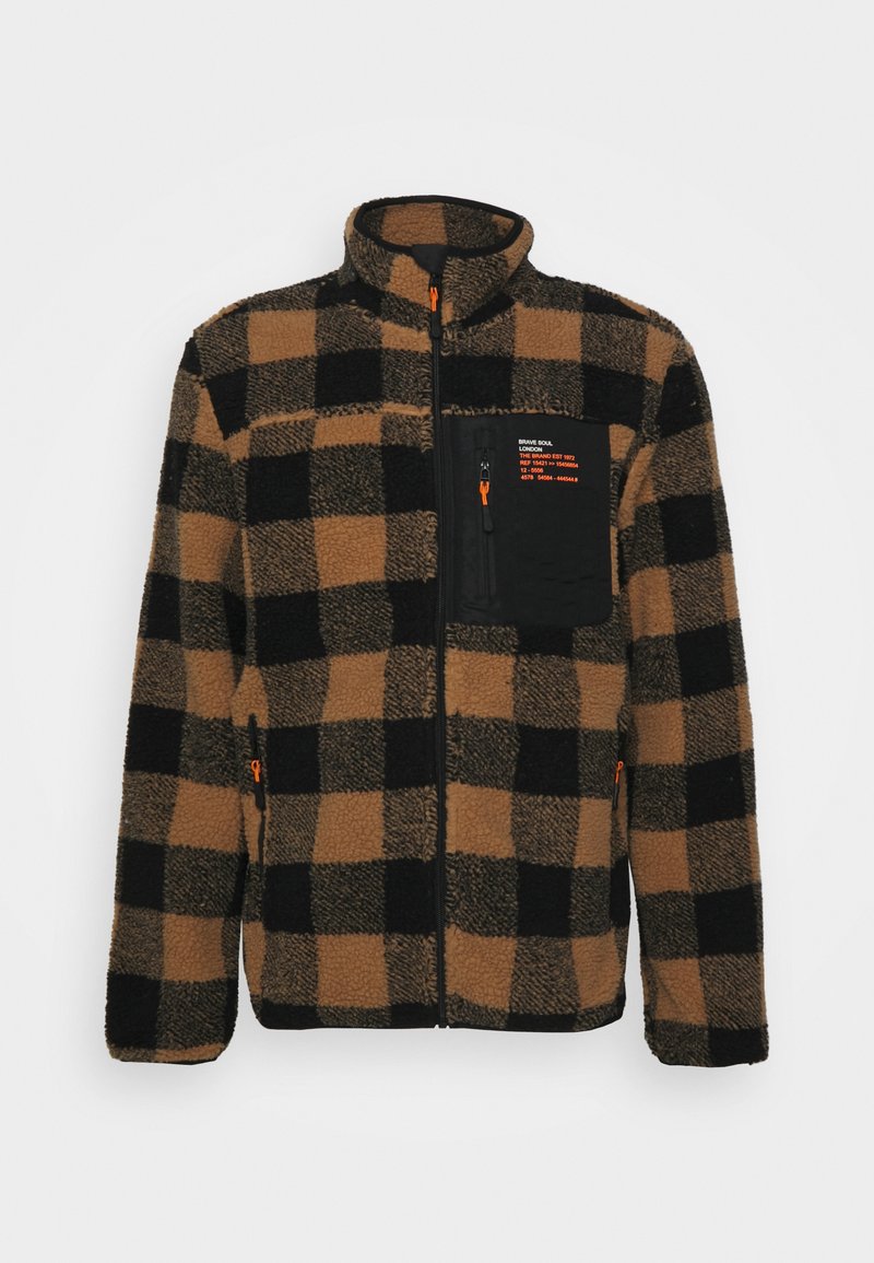 Casaco de lã com um padrão quadriculado em preto e castanho, gola alta, e bolso de peito com fecho éclair e detalhes em laranja. Tecido suave e texturizado.