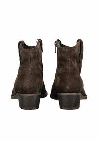Brown suede ankle boots with a slightly rounded toe, low stacked heel, and side zipper closure. Smooth texture and minimal design details.