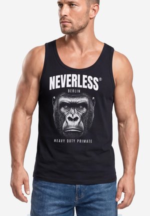 Muscular man wearing a black tank top with a large gorilla face and text "NEVERLESS Berlin Heavy Duty Primate," blue jeans.