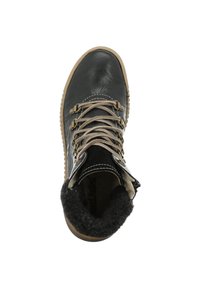 Bottine en cuir noir avec des lacets beiges, col en fausse fourrure et semelle en caoutchouc. Présente un bout arrondi et des coutures contrastées.
