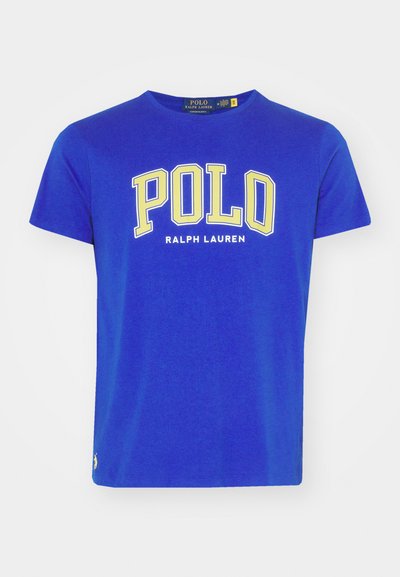 Blue cotton T-shirt with short sleeves, featuring large yellow "POLO" text and "RALPH LAUREN" underneath; small logo on the lower left.