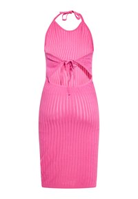 Fitted pink halter dress with vertical ribbed texture. It features a tie front and cut-out sides, ending just above the knee.