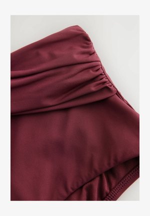 Maroon swimwear fabric featuring a gathered design with smooth texture. The edges are finished with elastic for a secure fit.