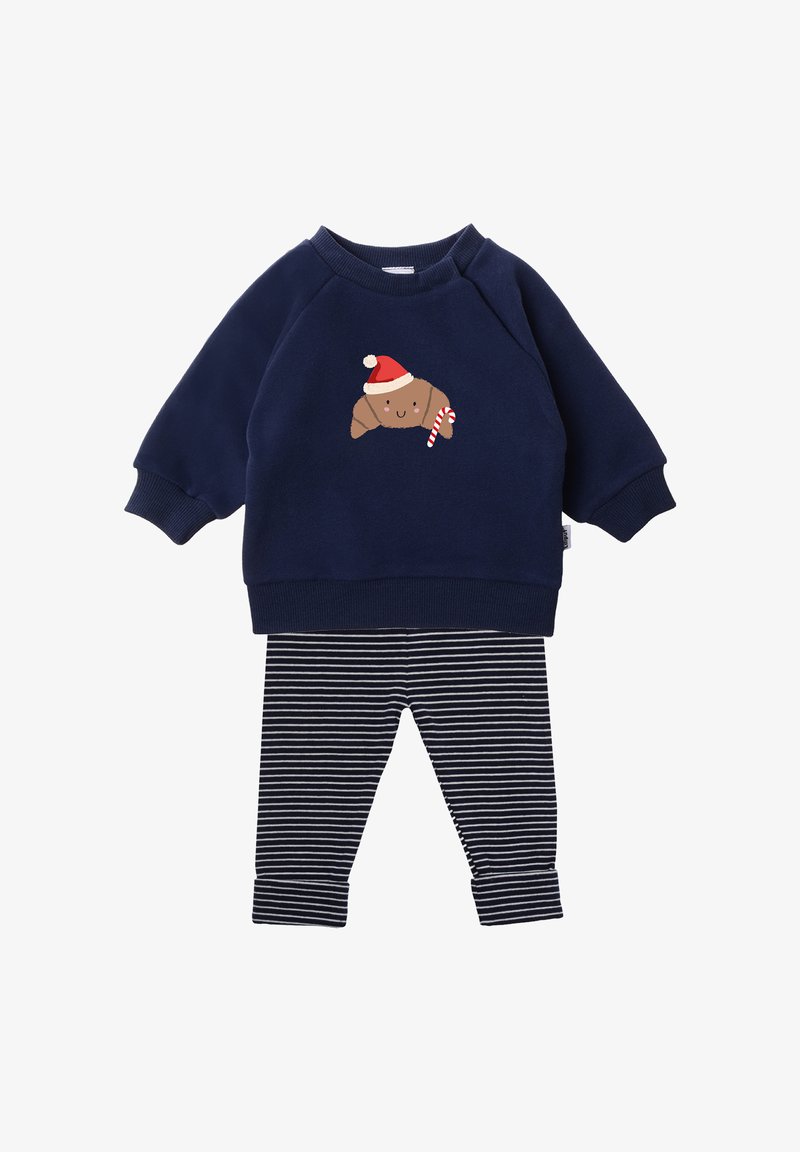 Navy sweatshirt with croissant graphic wearing a Santa hat, paired with black and white striped leggings. Soft fabric, ribbed cuffs.