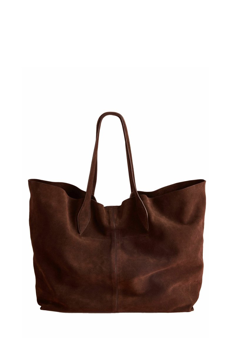 Brown suede tote bag with two long handles, open top, and a soft texture. Features a simple design and unstructured silhouette.