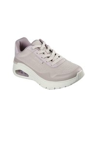 Zapatilla deportiva de color púrpura claro con parte superior de malla, cuello acolchado, cordones crema y unidad de amortiguación visible en el talón, con una suela texturizada.