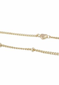 Guldtonad kedjearmband med snodda länkar, små runda pärlor och en hjärtformad låsning. Slät yta med en polerad finish.
