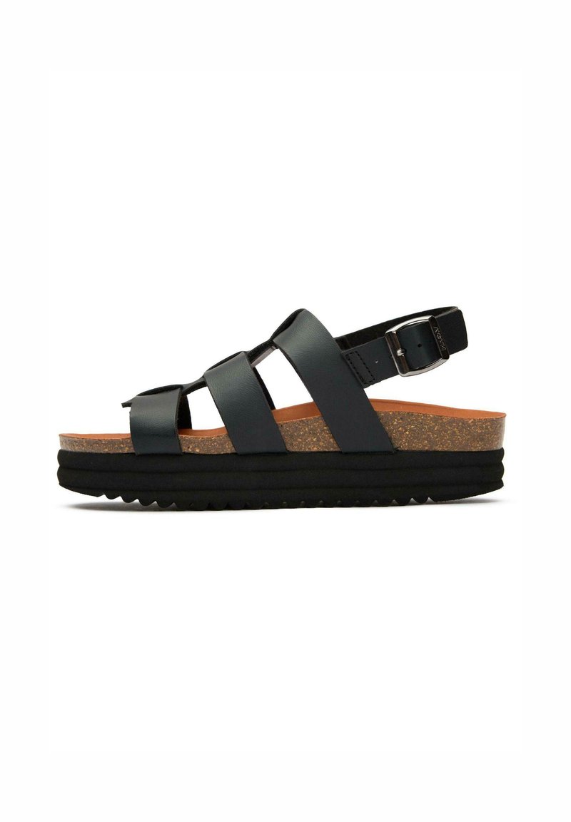 Black leather sandals featuring three wide straps, adjustable ankle buckle, cork midsole, and textured black rubber outsole.