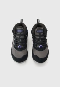 Pair of black and gray KEEN brand athletic shoes with purple accents, viewed from above on a white background.
