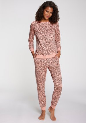 Pink leopard print loungewear set featuring a long-sleeve top with a round neckline and matching tapered pants with cuffed ankles.