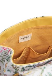 Floral handbag with a white exterior, yellow interior, and tan lining. Includes a label reading "FABLE ENGLAND" and three inner pockets.