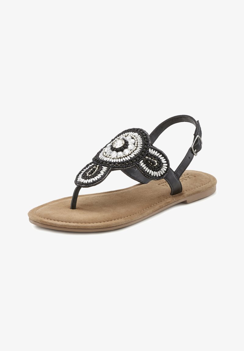 Black beaded thong sandal with a circular embellishment, featuring a cushioned tan footbed and adjustable strap. Textured surface detailing.