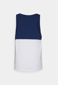 Débardeur sans manches bleu marine et blanc présentant un design à blocs de couleur unie, en coton, avec une texture lisse. Lignes épurées et simples.