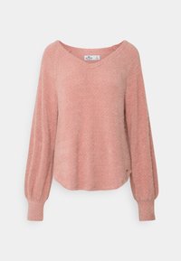 Maglione rosa, dalla trama elaborata, con scollo a V, maniche lunghe a palloncino e un orlo leggermente curvo. Realizzato in un materiale morbido e leggero.