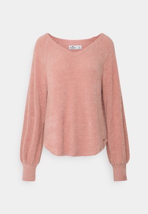 Vaaleanpunainen, teksturoitu neulepaita, jossa on V-pääntie, pitkät ilmapallohihat ja hieman kaareva helma. Valmistettu pehmeästä, kevyestä materiaalista.