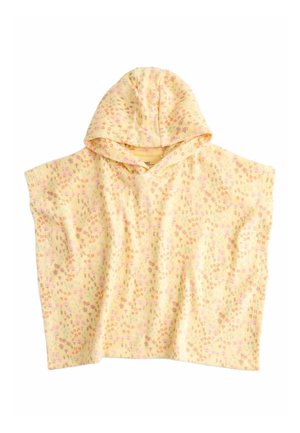 Gul hætte-løs poncho dækket med lille orange, pink og grøn floral mønster på hvid baggrund.