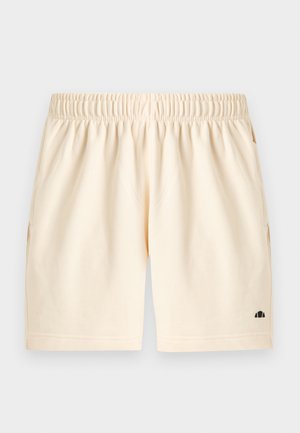 Shorts de couleur crème avec ceinture élastique, poches latérales et un petit logo noir près de l'ourlet inférieur sur la jambe gauche.