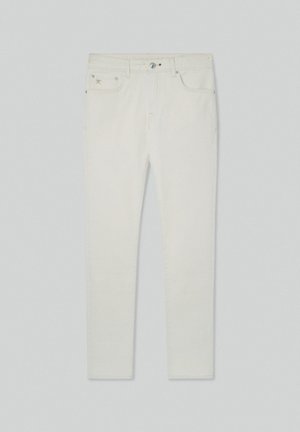 Valkoiset farkut slim fit -mallilla, joissa on viisi taskua, metallinappikiinnitys ja keltaiset ompeleet. Sileä rakenne, minimalistinen muotoilu.