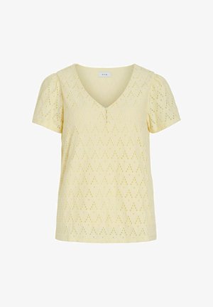 Kollane lühikeste varrukatega pluus V-kaeluse, pitsiliste aukudega kangaga, väikeste ees nuppudega ja põskedega varrukatega.