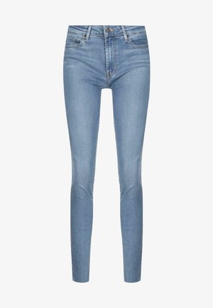 Jeans de denim de corte slim, en un tono azul claro. Cuentan con un diseño clásico de cinco bolsillos, cierre de botón metálico y detalles de costura sutiles.