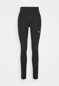 Černé sportovní legíny s vysokým pasem, vyrobené z hladkého materiálu. Obsahují švy a malé bílé logo na spodní části levé nohy.