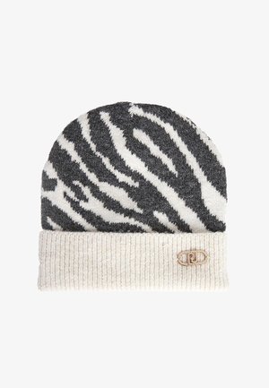 Berretto lavorato a maglia in grigio e bianco con design a stampa zebra e bordo a costine color crema. Include un accentuazione in metallo sul bordo.