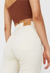 Stradivarius Flared Jeans - mottled beige