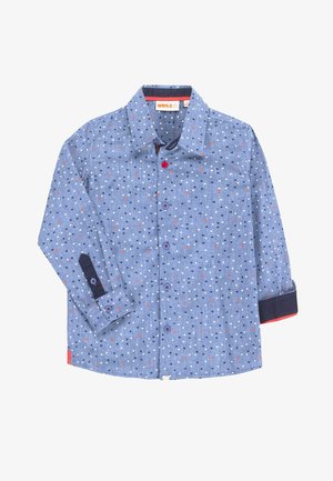 Blaues Langarmhemd mit Knopfverschluss, geschmückt mit kleinen weißen, schwarzen und roten Dreiecken, kontrastierenden dunkelblauen Manschetten sowie roten und blauen Knöpfen.