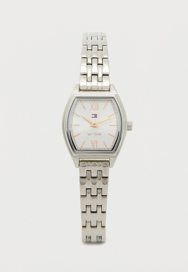 Silver metal watch with a square case, white textured dial displaying Roman numerals, and a link bracelet. Features a logo.