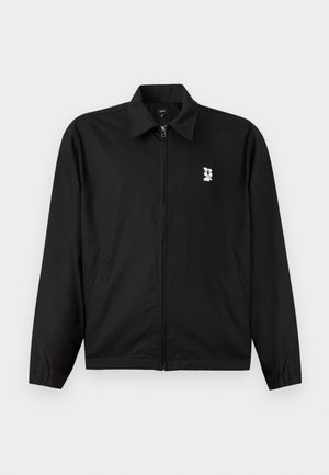 Black polyester jacket with a front zipper and a collared neckline. Features two side pockets and a white logo on the left chest.