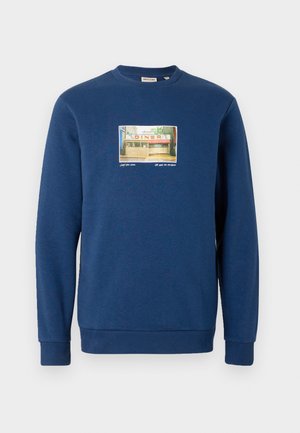Marineblauwe sweatshirt van zachte stof, met een rechthoekige grafische afbeelding van een diner op de voorkant. Geribbelde kraag en manchetten.