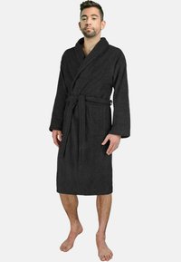 Schwarzer Bademantel aus Frottier mit Wickeldesign, langen Ärmeln und gebundenem Gürtel. Hat eine Fronttasche und einen knielangen Saum. Weiche Textur.