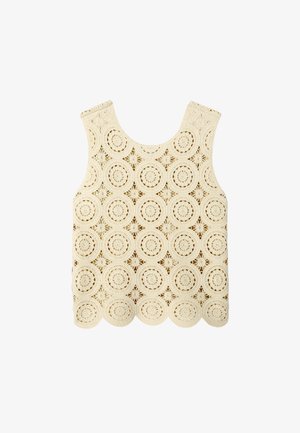 Top en crochet sans manches couleur crème avec motifs circulaires et étoilés et ourlet festonné, posé à plat sur fond blanc.