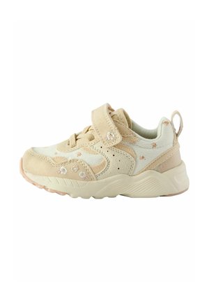 Beige og cremefarvet småbørnssneaker med blomsterbroderi, velcrorem, snørebånd og en tekstureret gummisål.